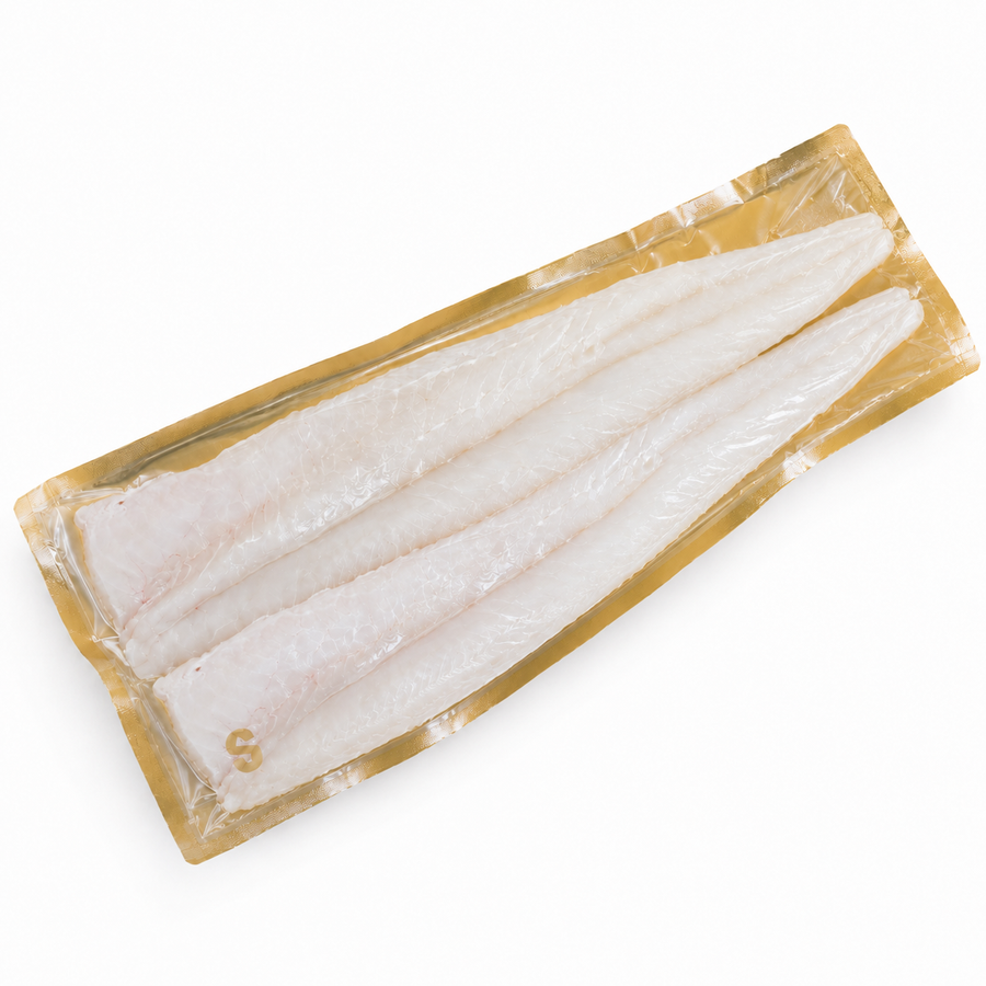Packaged kingklip fish fillets on a white background